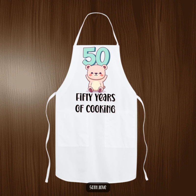 Funny 50th birthday apron showing a bear balancing the number 50 on its head, ideal for a humorous cooking experience.