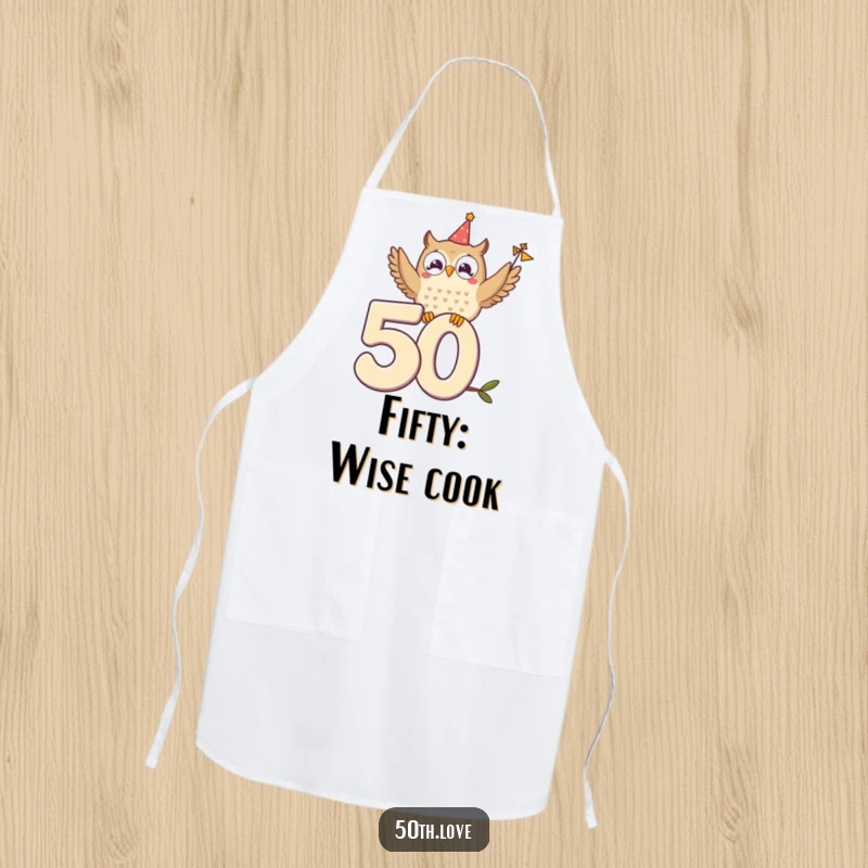 Funny chef apron featuring a delighted owl perched on a '50', waving a tiny festive banner.