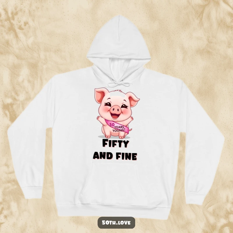 Funny 50th birthday hoodie featuring a cute, giggling piglet wearing a '50 Years Young' sash, perfect for cozy birthday celebrations.