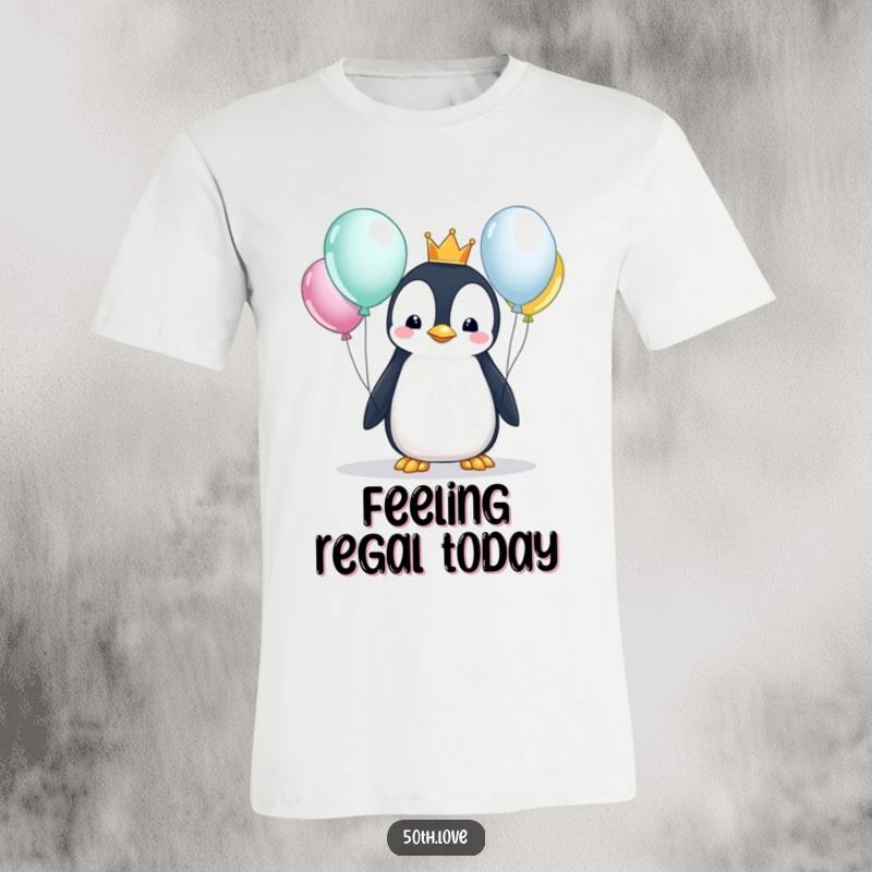Funny penguin with a tiny crown inspecting shiny balloons on a t-shirt, embodying a curious and regal birthday vibe.