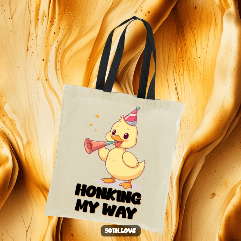 Funny tote bag featuring a playful duckling vigorously blowing a party horn, perfect for carrying party supplies and everyday items.